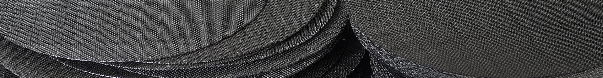 Many black wire cloth sheets are placed together.
