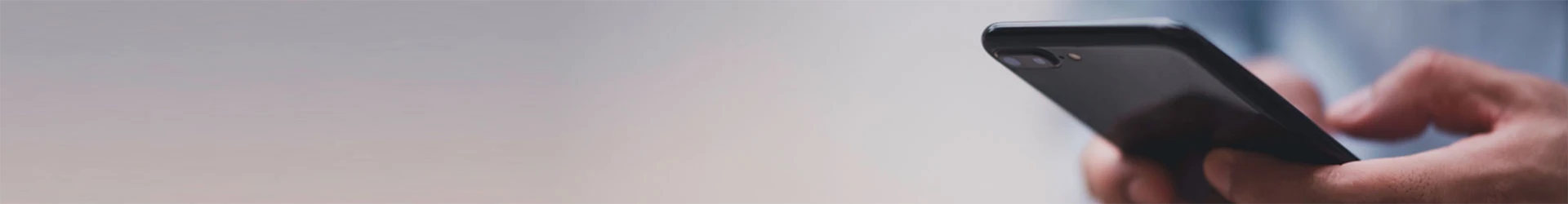 A man is holding a mobile phone.