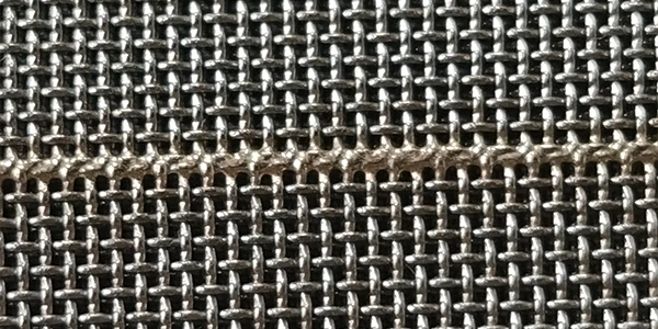 2 pieces of woven mesh connected by welding