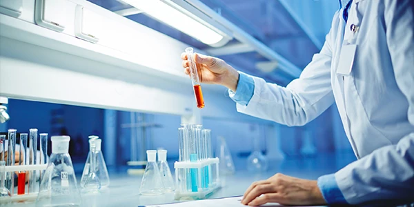 A person holding a test tube