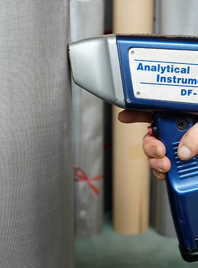 /img/A tester is used for woven mesh inspection.