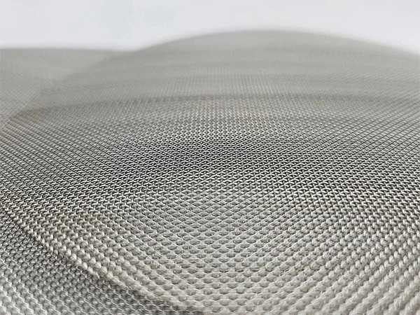 2 stainless steel dutch weave filter discs stacked together