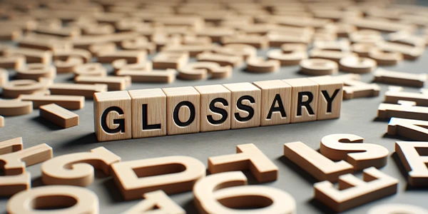 A magnifying glass and many English letters scattered on a table