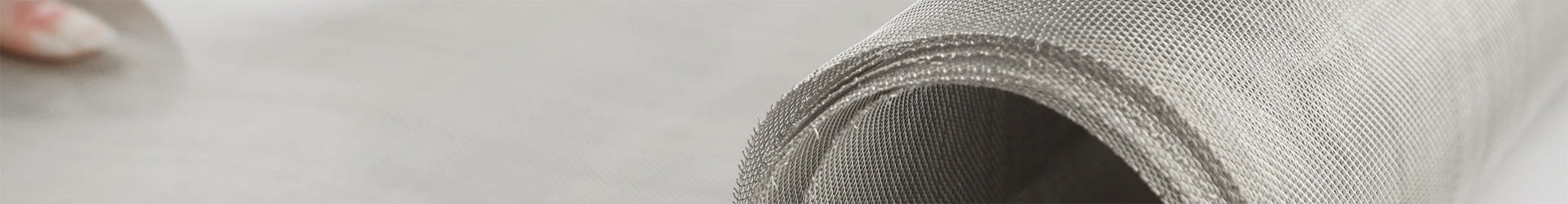A roll of stainless steel woven mesh