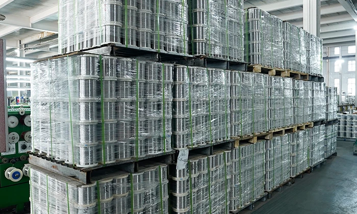 Many stainless steel wire rolls are placed together.